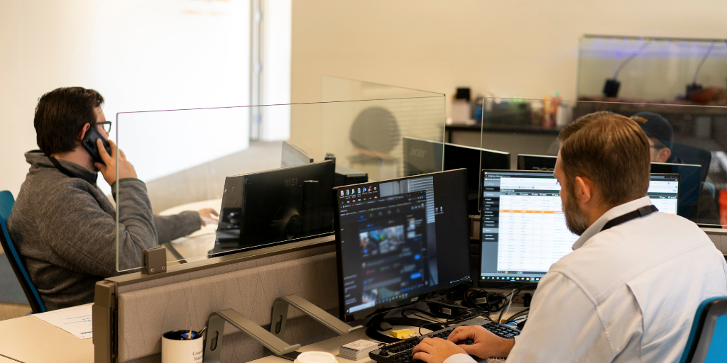 Excel Employees on Phone and Computer